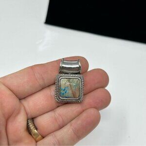 Silver tone stone pendant